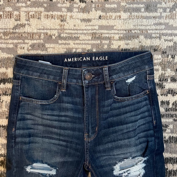 American Eagle | Highrise Next Level Stretch Destressed Dark Blue Jean - Picture 5 of 11